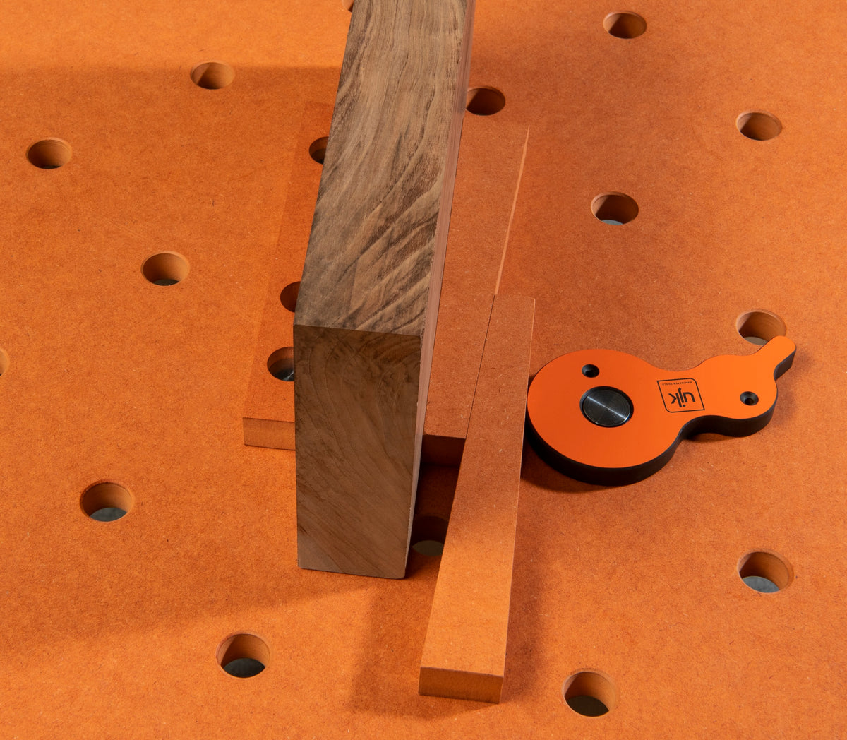 UJK Backstop for Dog Hole Workbenches, showing three dog holes for versatile positioning on multifunction table
