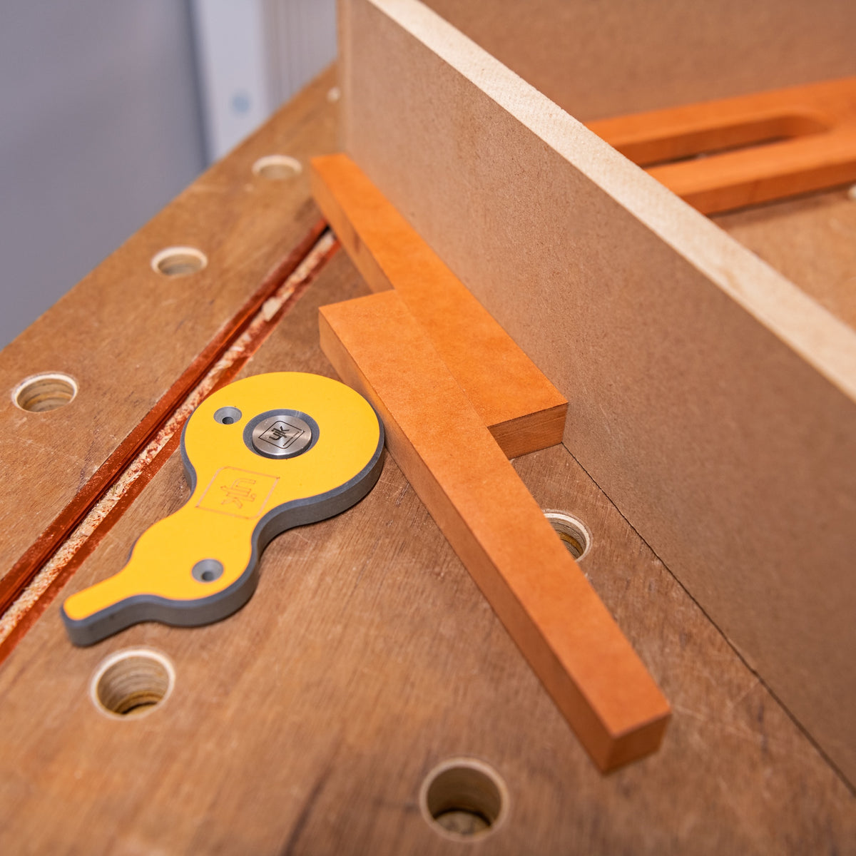 UJK Cam & Wedge Clamping Set in use on a 20mm dog hole workbench
