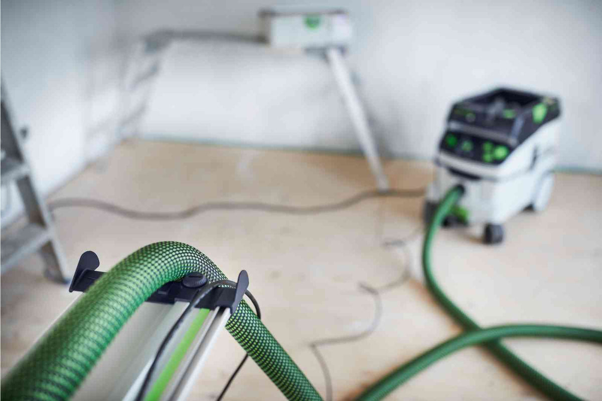Festool FS Guide Rail Hose Guide Deflector attached to woodworking saw