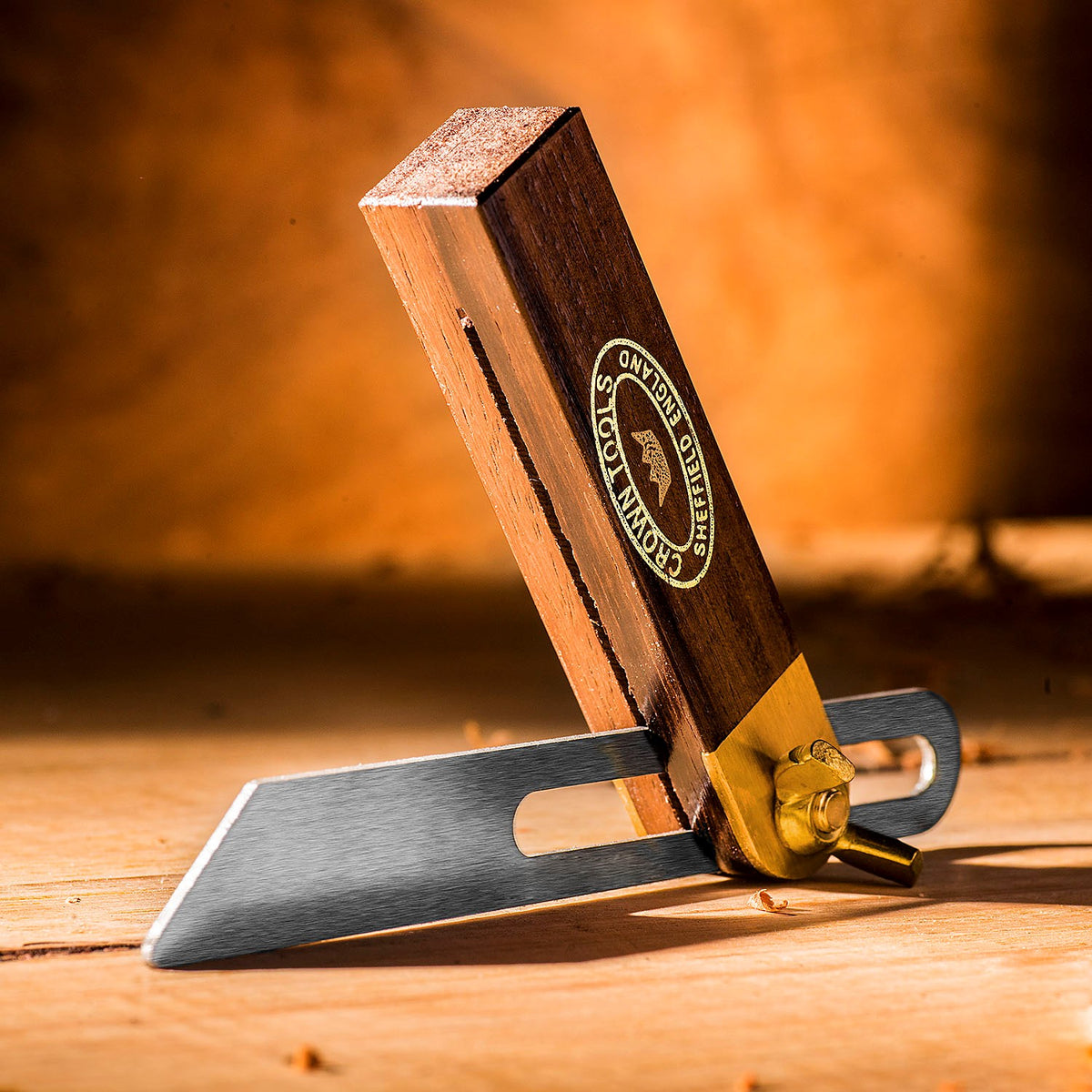 Crown Sliding Bevel 100mm Blade with Rosewood & Brass Handle, angled view showcasing tool steel blade and brass wing nut