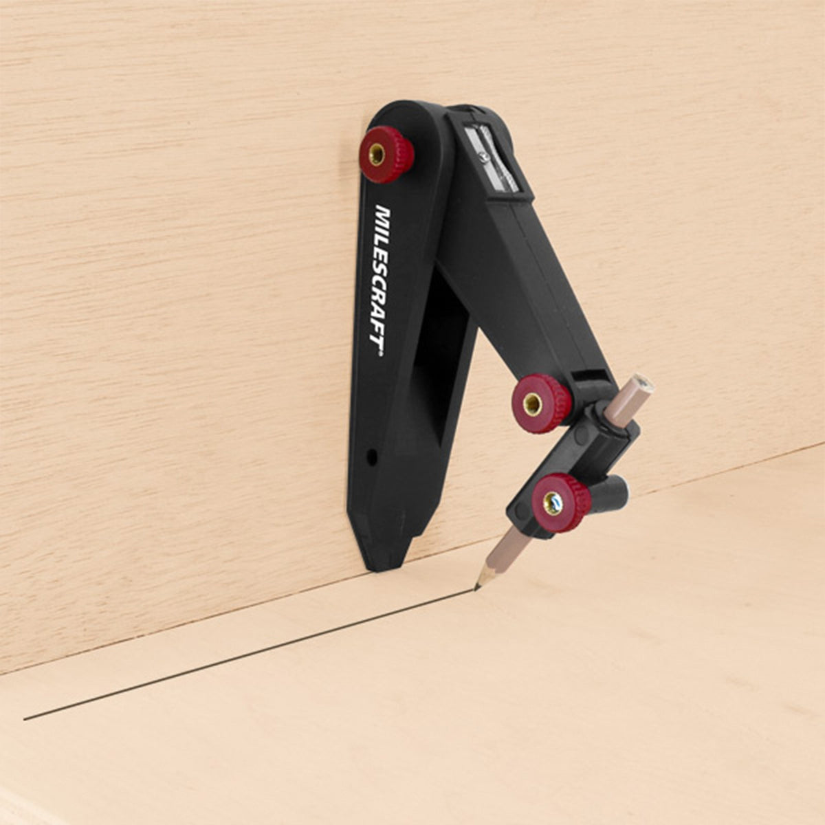 Handheld Milescraft ScribeTec for precise scribing of architectural mouldings and cabinet trim
