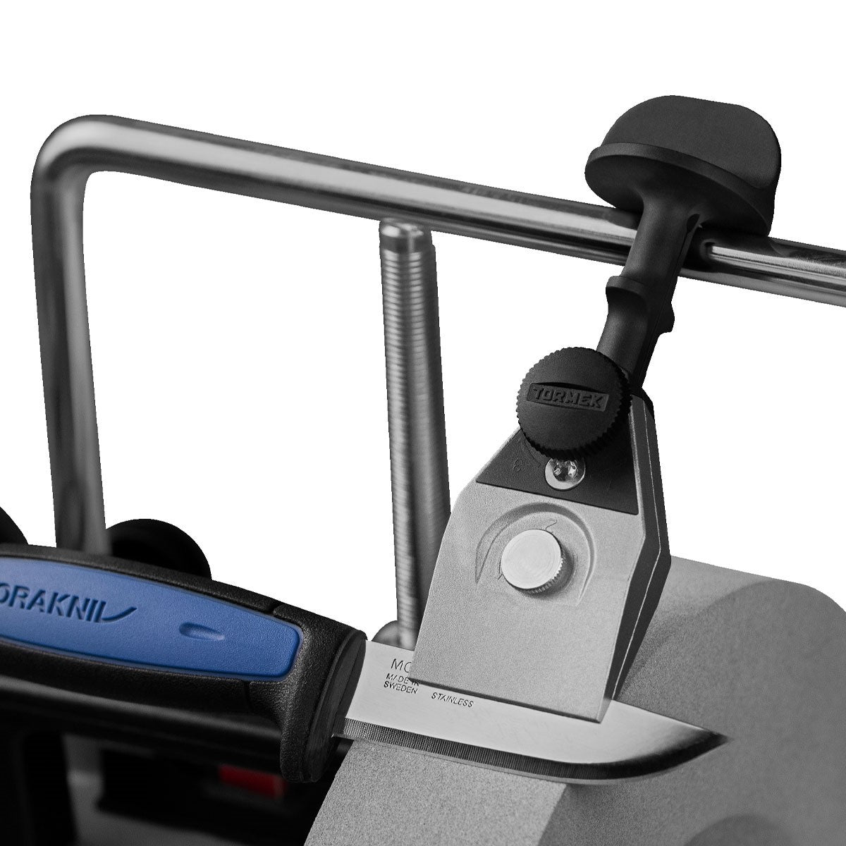 Tormek Wetstone Grinder Standard Centering Knife Jig in use, producing razor-sharp edges efficiently