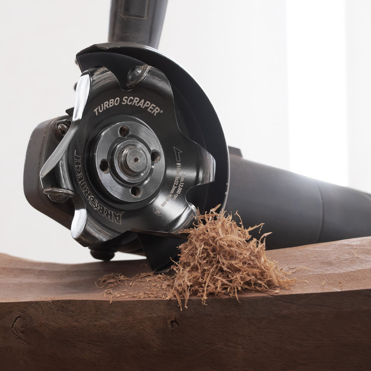 Arbortech Turbo Scraper attachment in action on wood surface