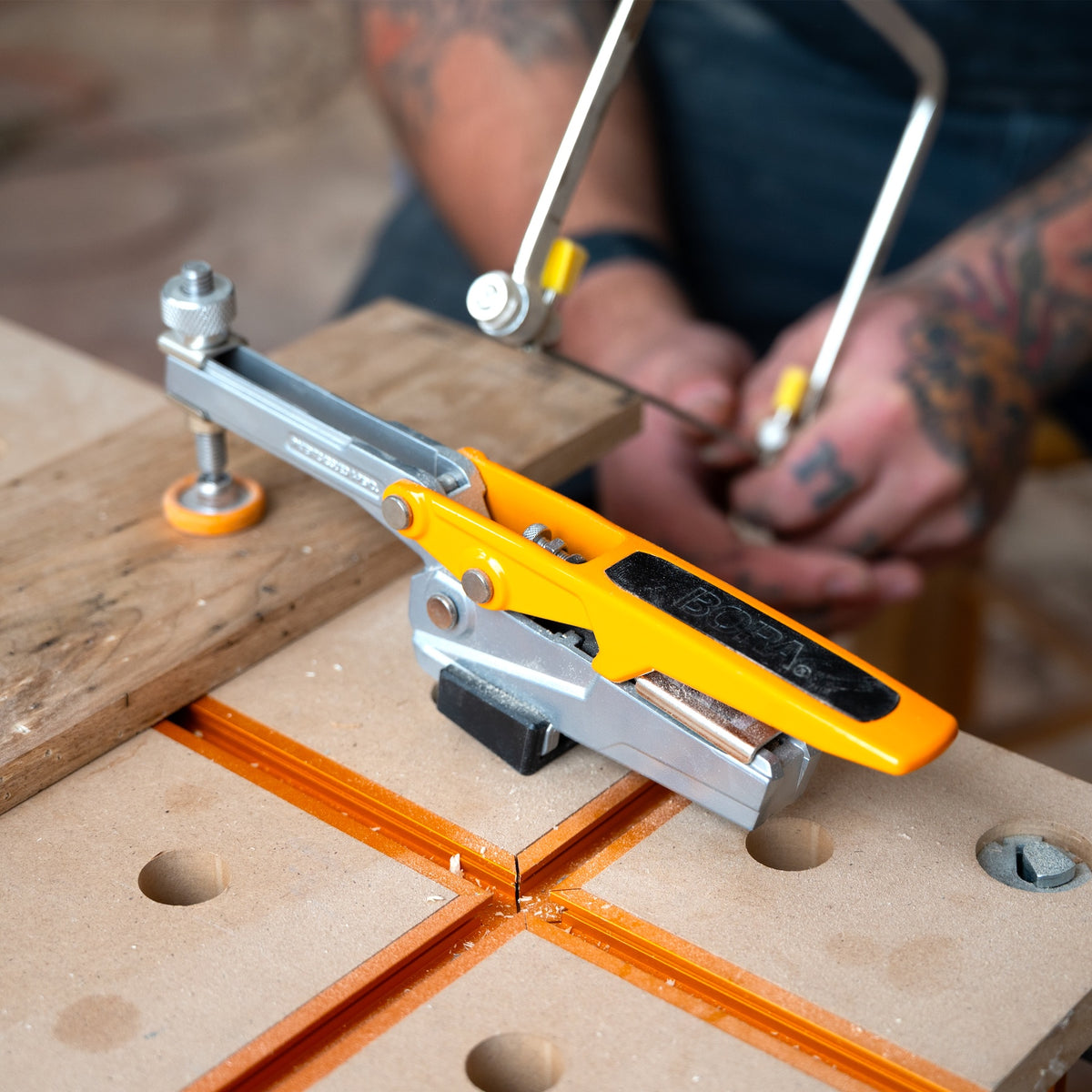BORA Tool Dog Hole Auto Adjust Horizontal Toggle Clamp in use on workbench