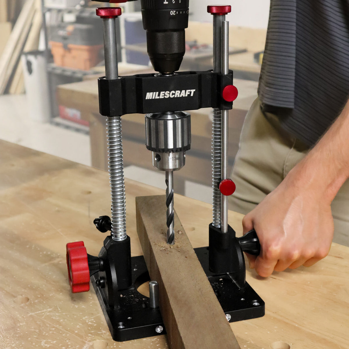 Milescraft DrillMatePRO portable drill guide in use on a wooden workpiece