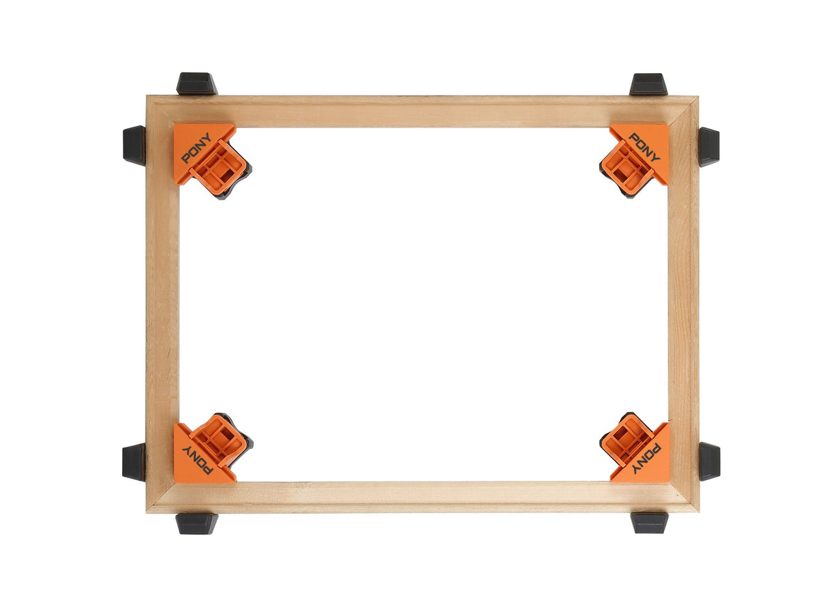 Pony Jorgensen Set of 4 Quick-Release Corner Clamps in use on wooden frame