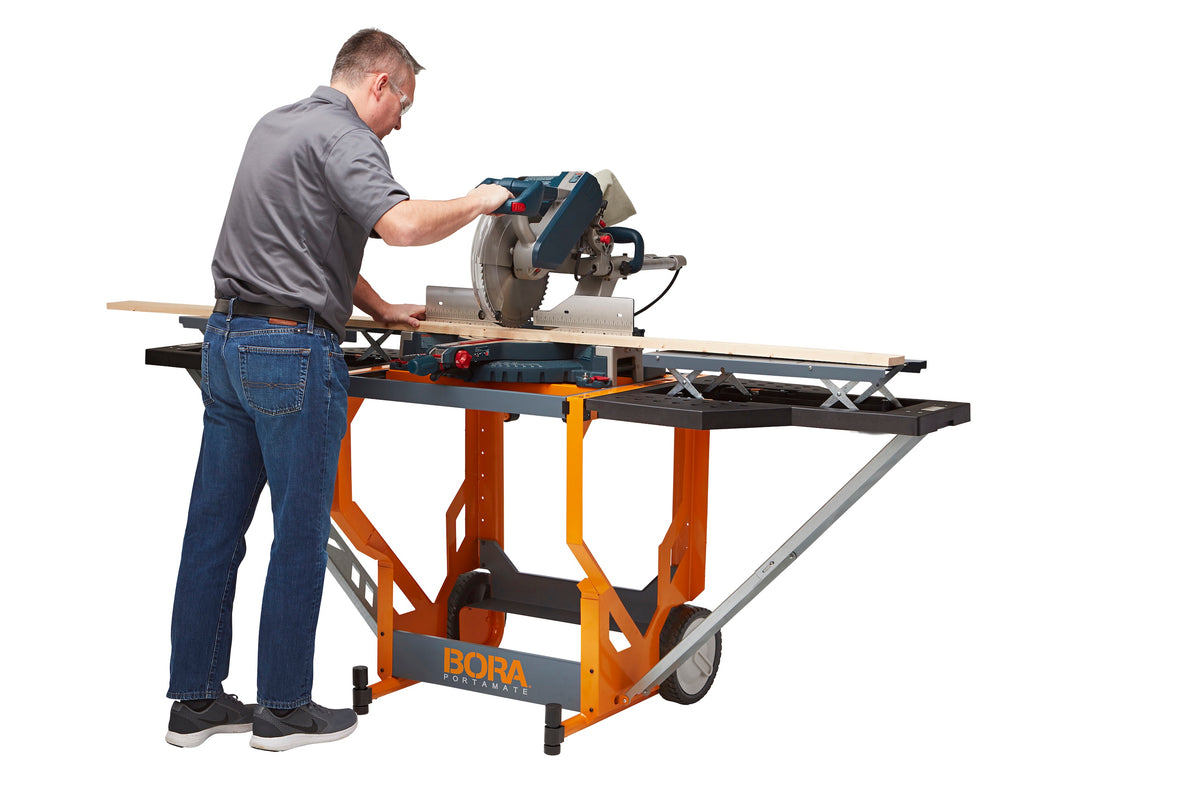 BORA Portacube STR Mitre Saw Workstation with Rotating Table shown in use with extended extension wings