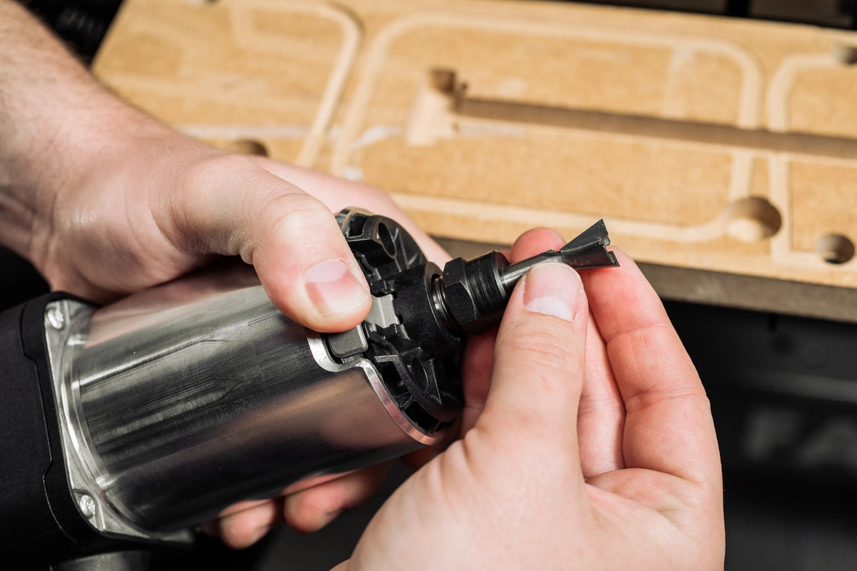 Shaper Tools 15 Degree Dovetail CNC Router Bit in action, cutting precise dovetail joints in hardwood