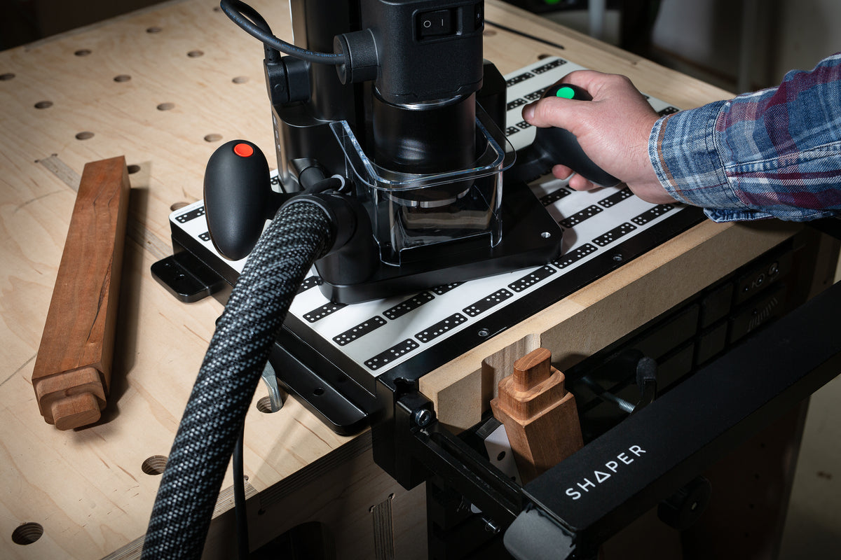 Shaper Workstation for Origin Handheld CNC Router in woodworking setting