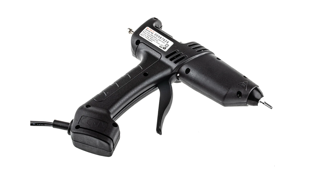 Power Adhesives Knottec Light Industrial Wood Repair Kit hot glue gun applicator in use on timber surface