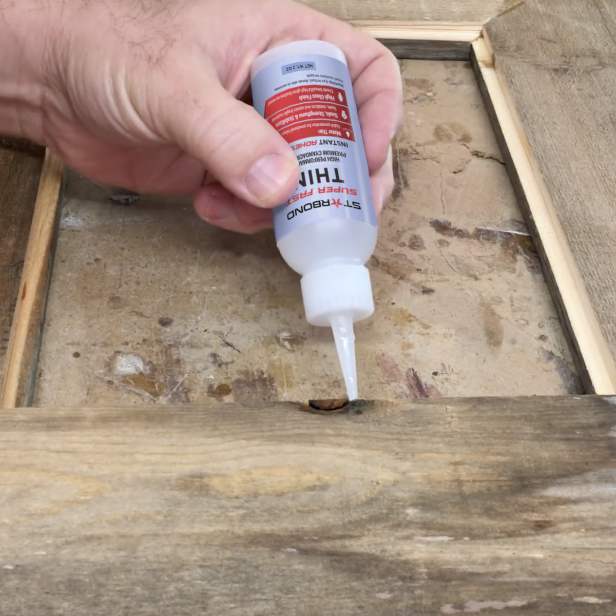 Starbond Super Fast Thin CA Super Glue bottle, showing the ergonomic design and easy application