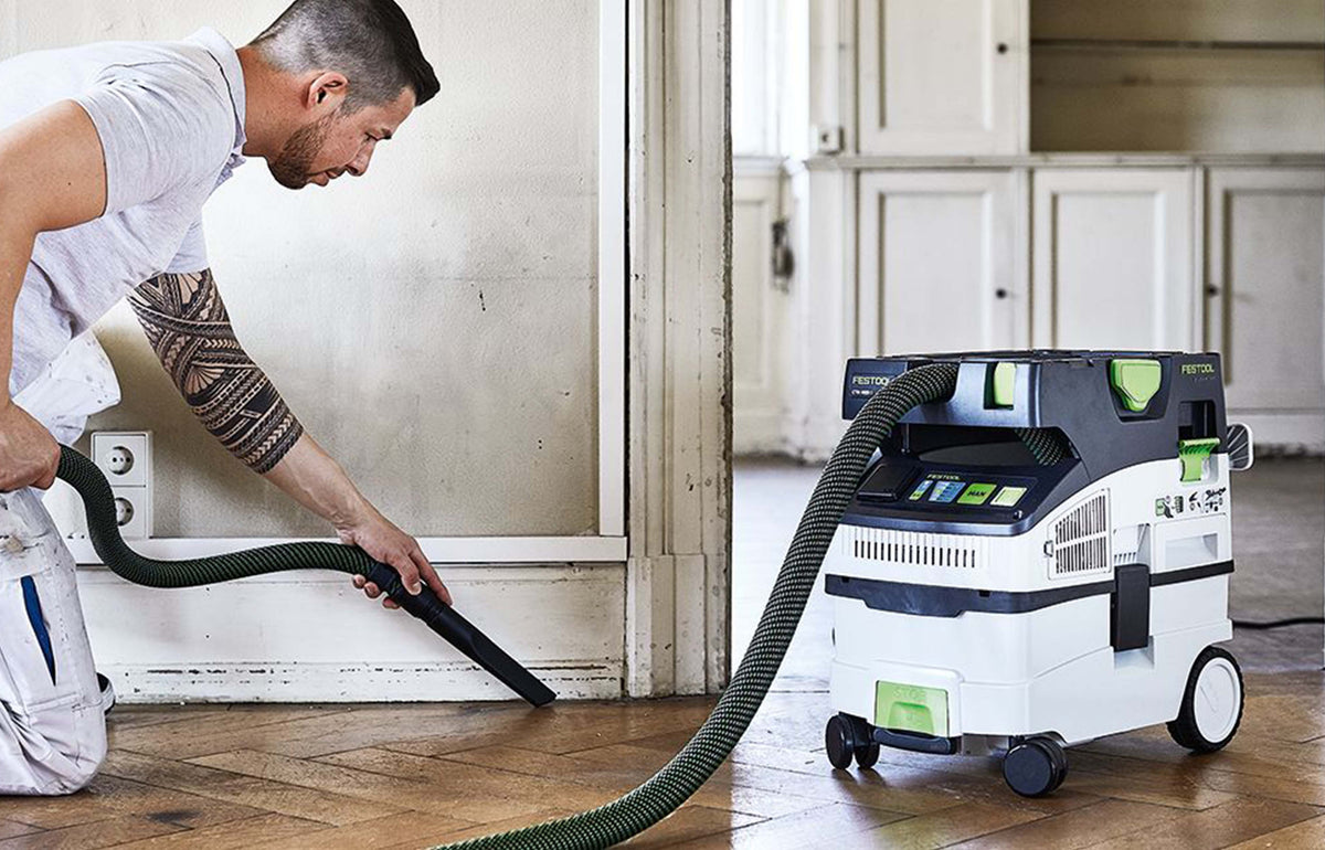 Festool CTM MIDI compact extractor in action, demonstrating efficient dust extraction capabilities for woodworking tasks