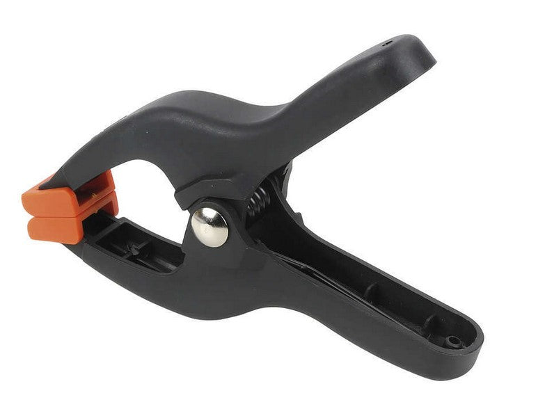 Pony Jorgensen 25mm Plastic Spring Clamp with Pivoting Jaw Pads in use on woodworking project