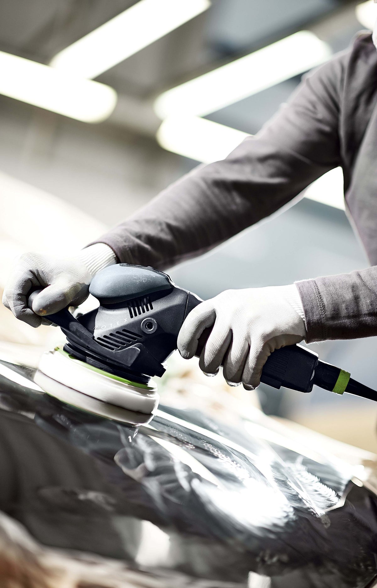 Festool RO 150mm ROTEX 3-in-1 Random Orbital Sander in Systainer in action sanding a wooden surface