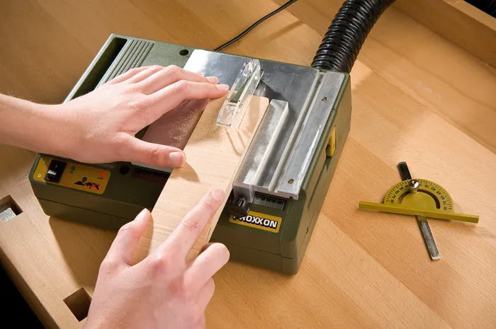 PROXXON KS-230 Benchtop Mini Table Saw 85W in action, showcasing its precision cutting capabilities