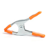 Pony Jorgensen Metal Spring Clamp 51mm Capacity with Protectors in action on wood piece