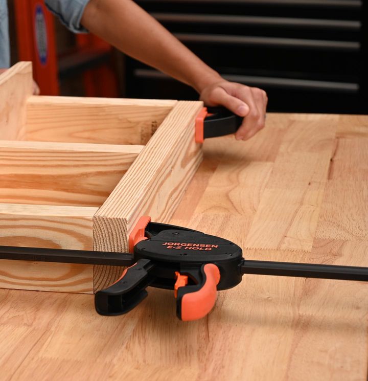 Pony Jorgensen E-Z HOLD Trigger Clamps in use - woodworking tool angled view