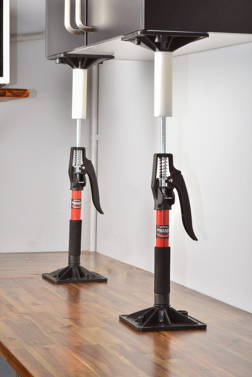 FastCap 3rd Hand Little Hand XL Twin Pack for cabinet installation - angled view showing adjustable support poles in use