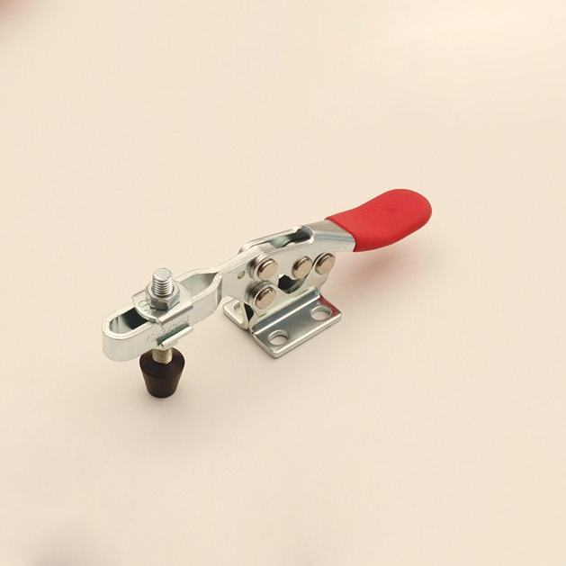 Small horizontal toggle clamp mounted on woodworking bench. Ideal for repetitive clamping in various applications