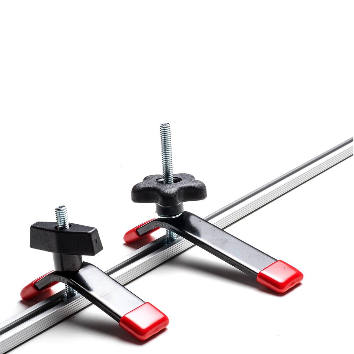Small Torquata Hold-Down Clamp in action on T-Track workbench