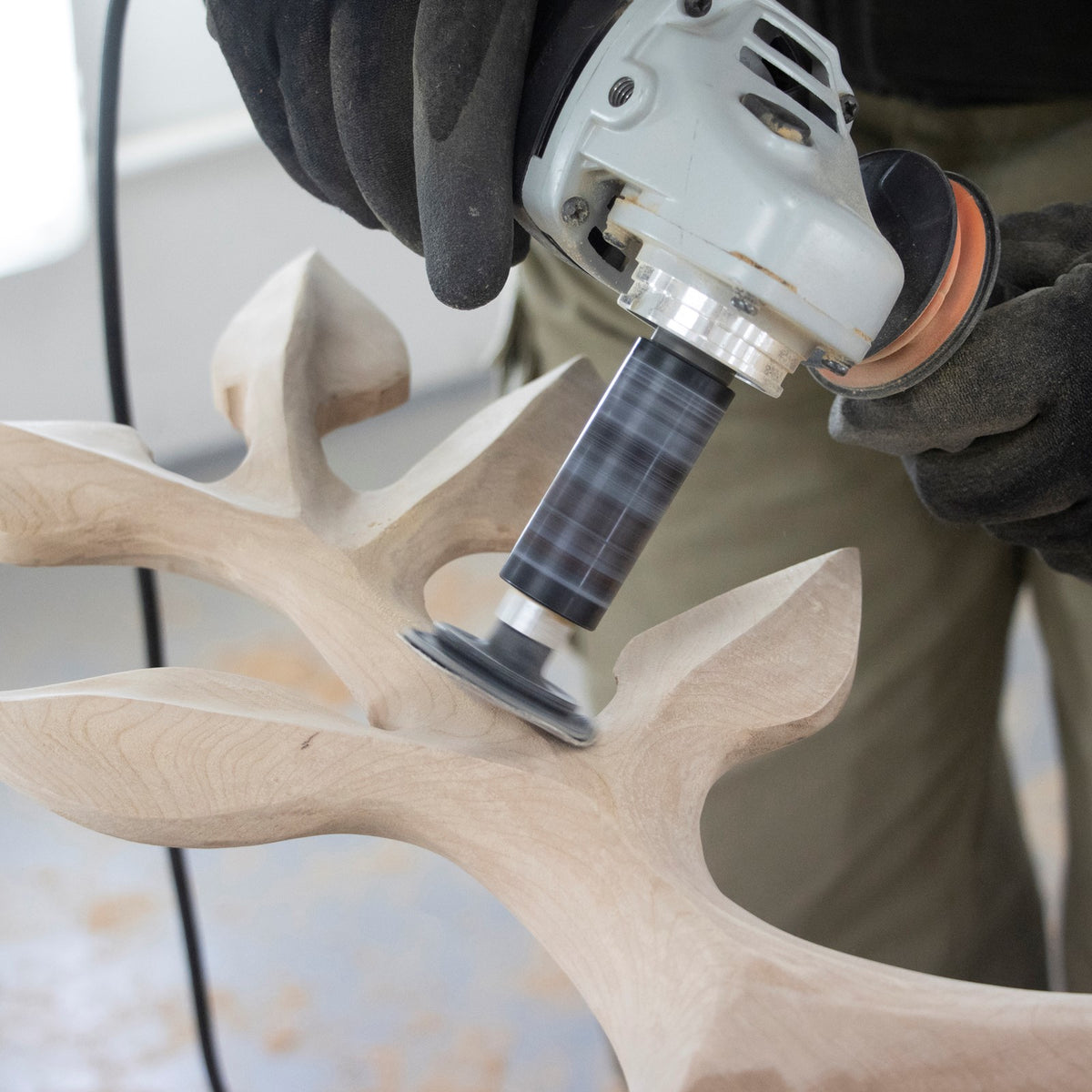 Arbortech Contour Sander in action on woodwork with M14 thread attachment and sanding discs