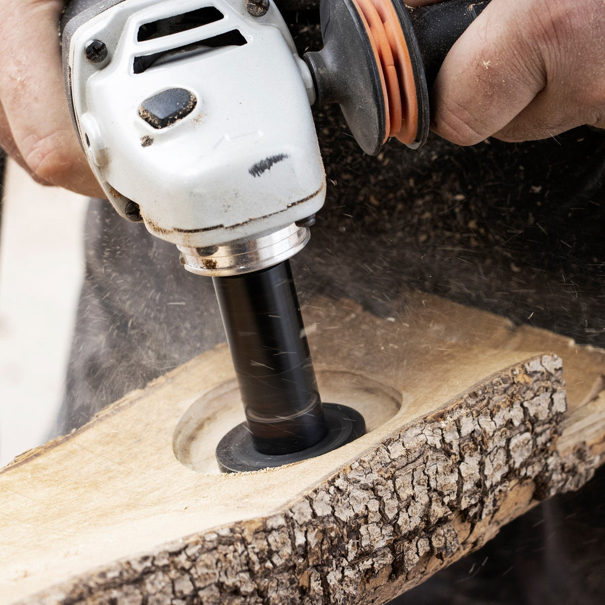Arbortech Mini Turbo carving attachment in action on wood surface, showing fine control and detailed wood sculpting