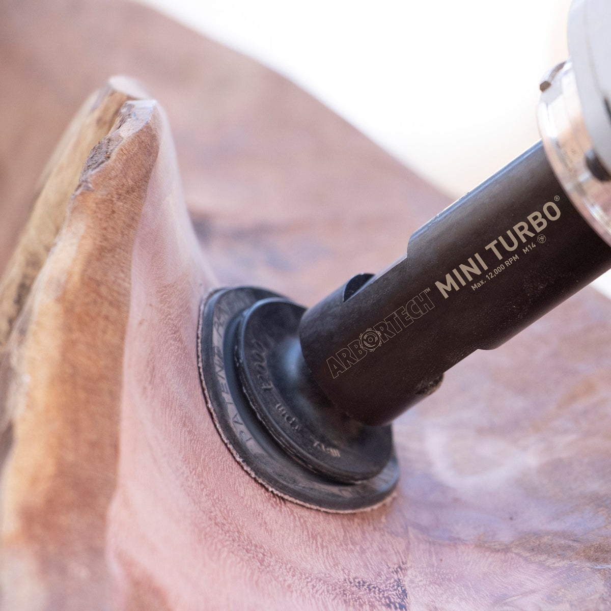Arbortech Mini Turbo Carving Attachment sanding pad in action on wood