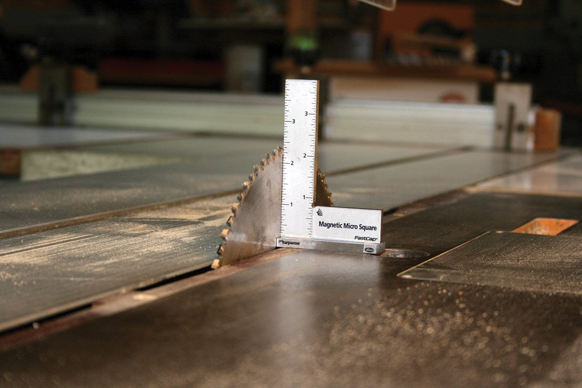 FastCap Magnetic Micro Engineer's Square in use on a table saw with Metric and Imperial graduations visible
