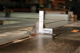 FastCap Magnetic Micro Engineer's Square in use on a table saw with Metric and Imperial graduations visible