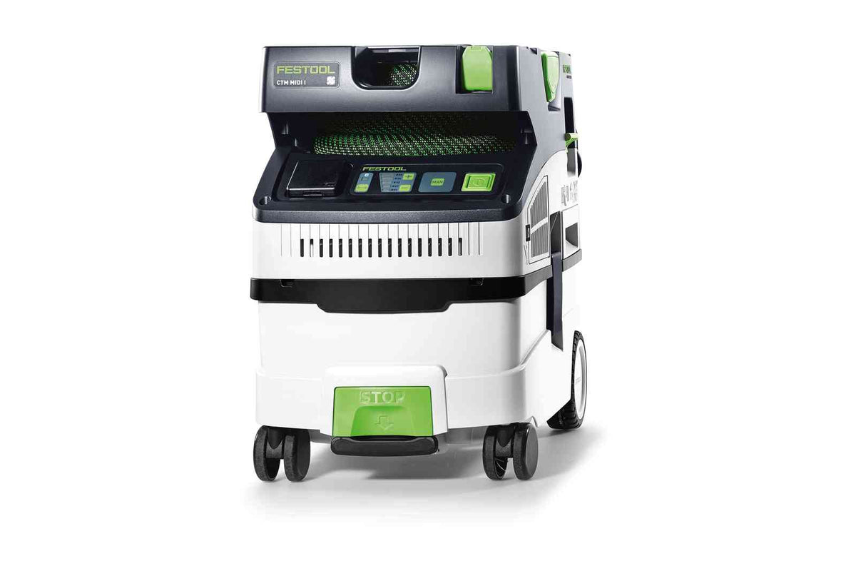 Compact Festool CTM MIDI-I 15L M Class Dust Extractor in use with hoses and tools stored nearby
