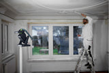 Compact Festool SYSLITE KBS C cordless construction light in use on a construction site, providing 5000 lumens brightness