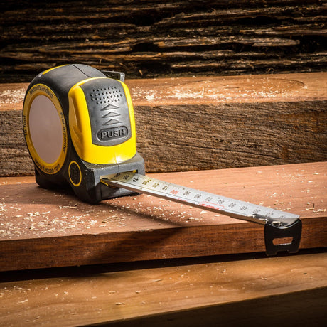 FastCap Auto-Lock Tape Measure showing the innovative auto-lock feature and built-in pencil sharpener