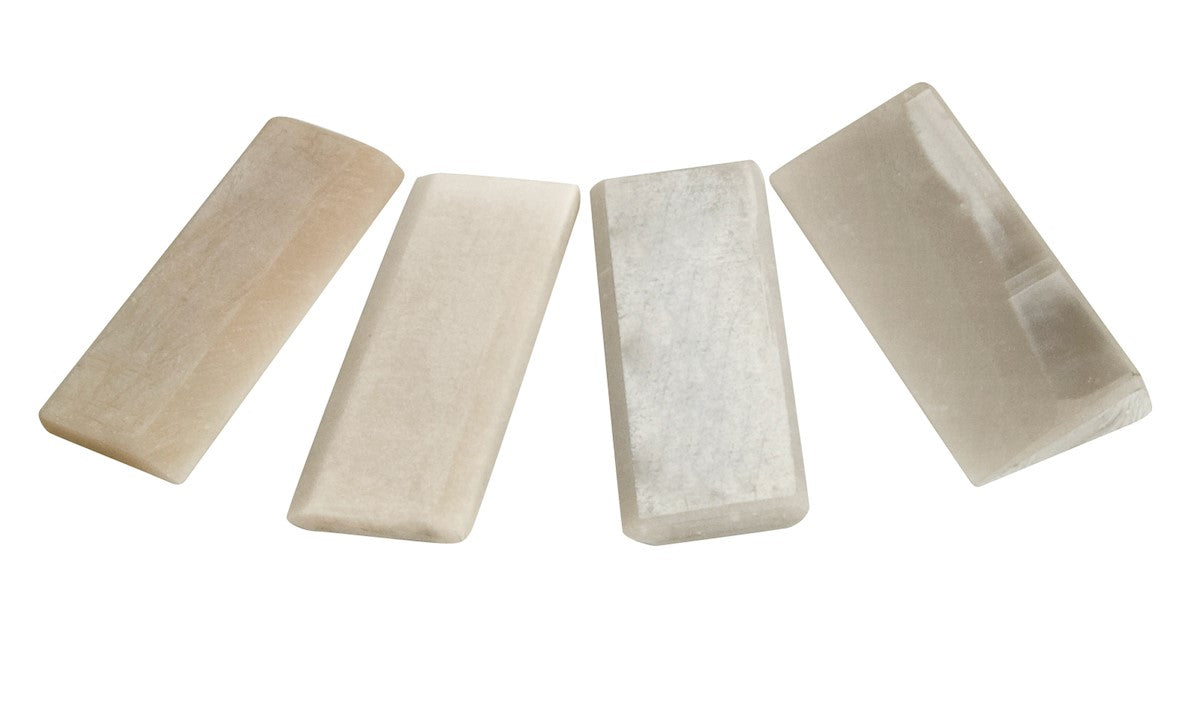 Four Arkansas sharpening stones for carving tools, in a cardboard display box. Natural stone cut, suitable for all chisel shapes