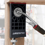 Milescraft PocketJig300 heavy-duty portable clamp on joinery jig in use on a wooden board