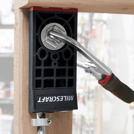 Milescraft PocketJig300 heavy-duty portable clamp on joinery jig in use on a wooden board