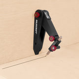Handheld Milescraft ScribeTec for precise scribing of architectural mouldings and cabinet trim