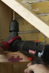 Milescraft Orbiter Adjustable Angle Drill Attachment in use, showcasing versatile drilling capabilities
