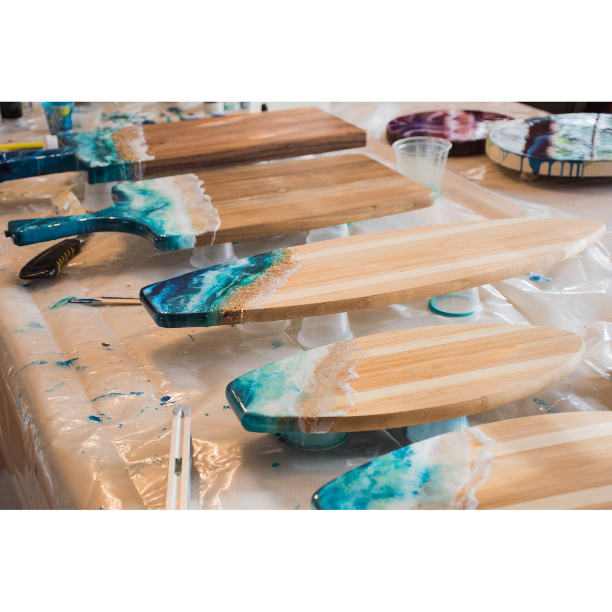 LuciClear Art Resin boards showing smooth finish and vibrant colors