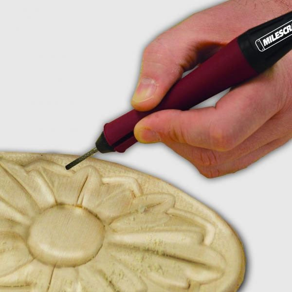 Milescraft FlexShaft XT in use with rotary tool, showcasing ergonomic pen grip for precise and intricate woodworking tasks