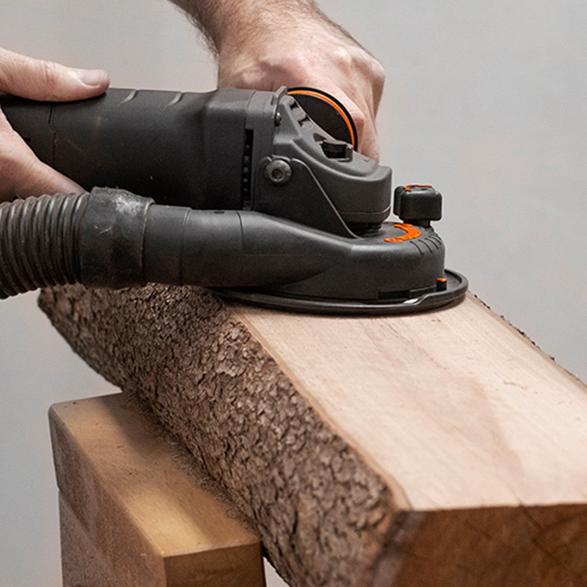 Arbortech Angle Grinder Power Carving Unit 1000W in action on wood sculpture