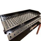 Sherwood Downdraft Table capturing fine dust particles for dust-free sanding