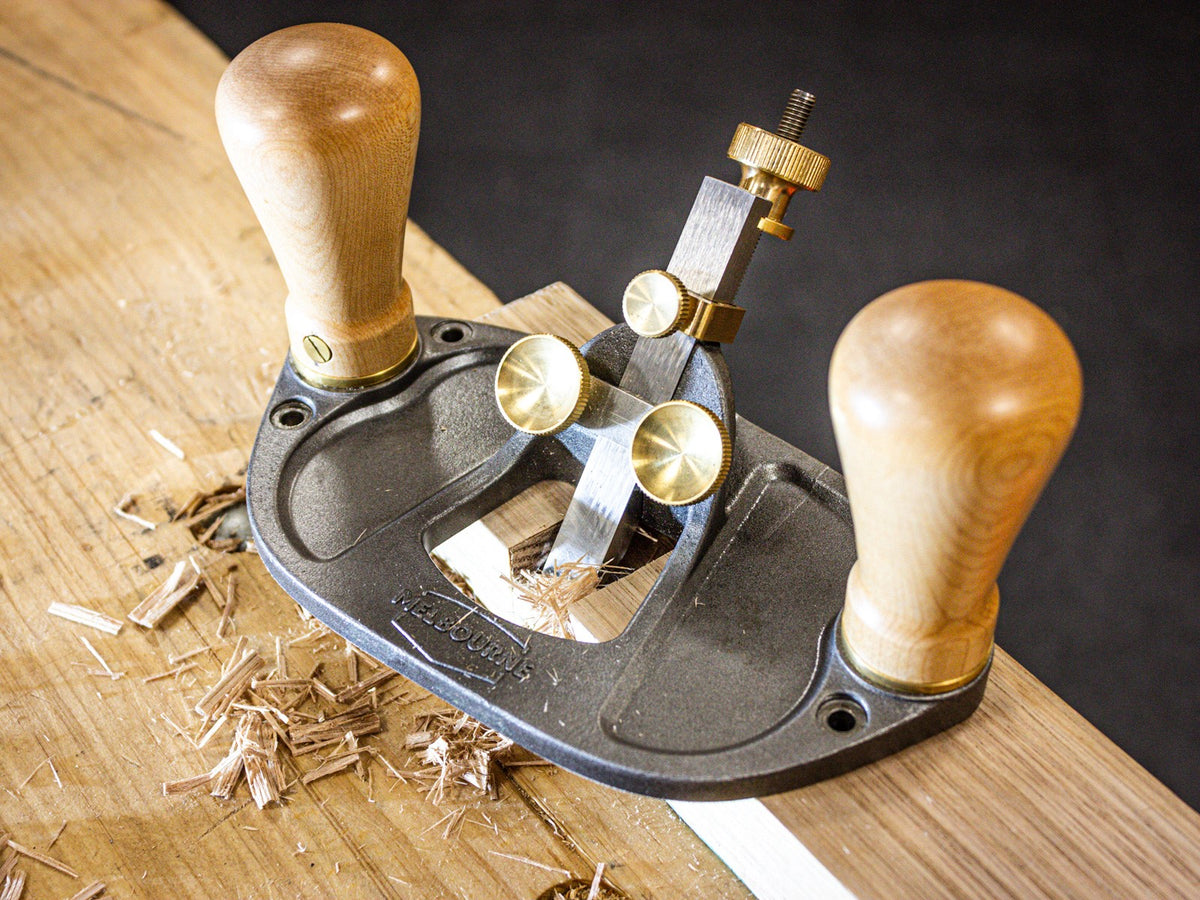 Melbourne Tool Company small and large router hand planes in use on a wooden surface