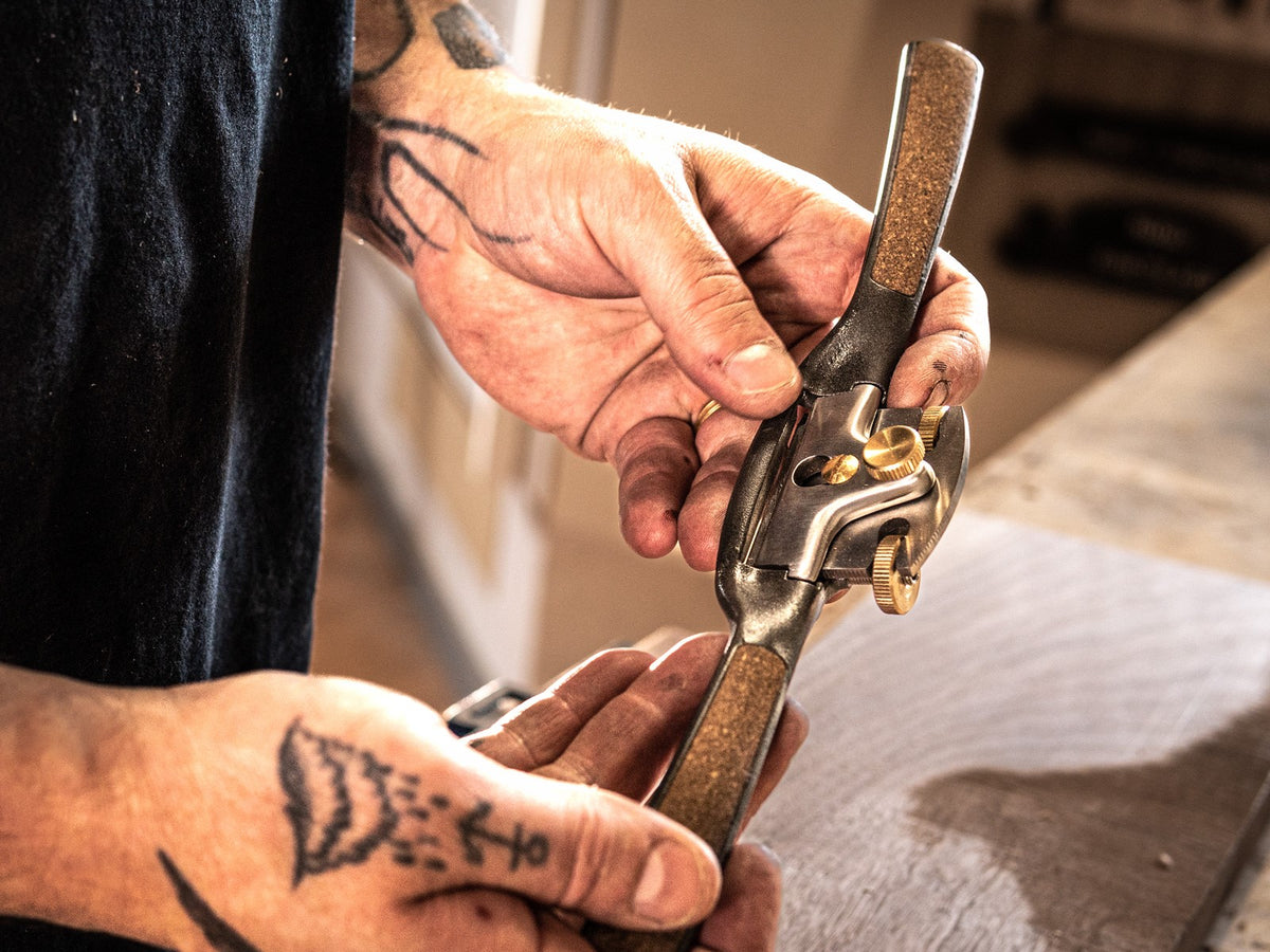 Melbourne Tool Company Set of Nine Hand Planes & Tools - Close-up of spokeshave tool in use