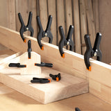 Pony Jorgensen Set of 14 Plastic Spring Clamps with Pivoting Jaw Pads in 19-76mm sizes, ideal for instant clamping in woodworking