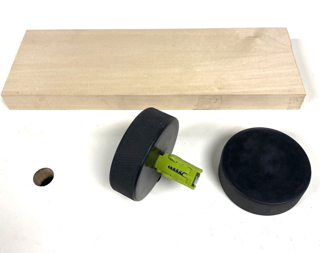 Bow Products Pack of Dogs woodworking bench dogs in use on a workbench with hex bolt and ergonomic bow knob