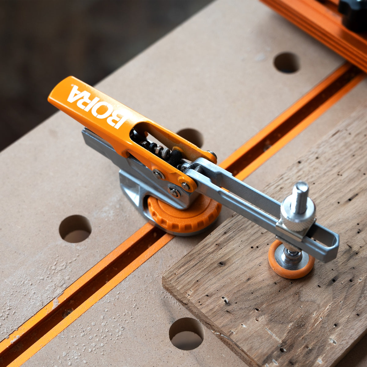 BORA Tool Auto Adjust T-Track Standard Toggle Clamp in use on woodworking project