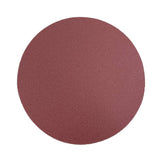 Round sandpaper disc on a white background