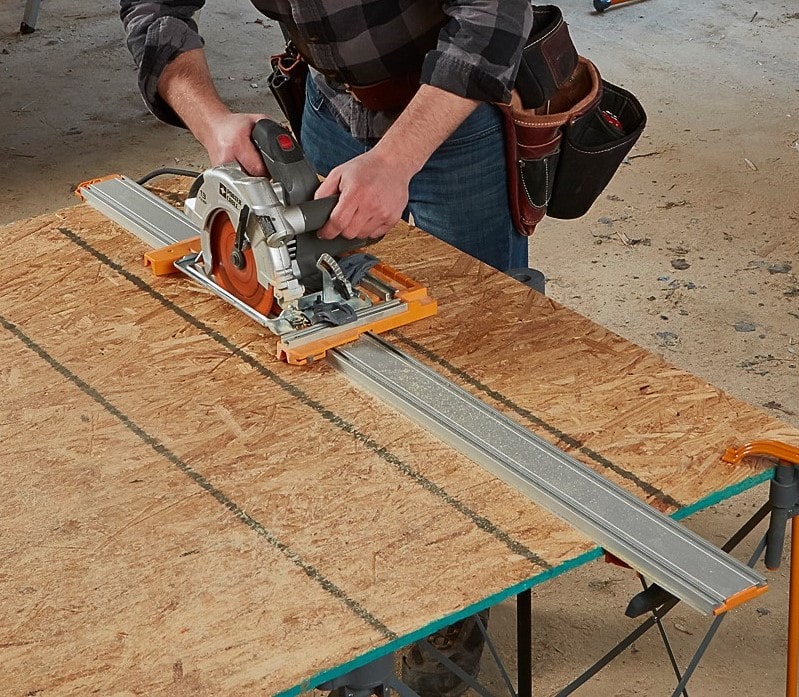 BORA NGX Clamp Edge Saw Guide in use, attached to sheet material for clean, precise cuts