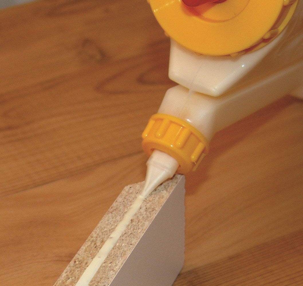 FastCap GluBot 448mL woodworking glue dispenser in action at an angle