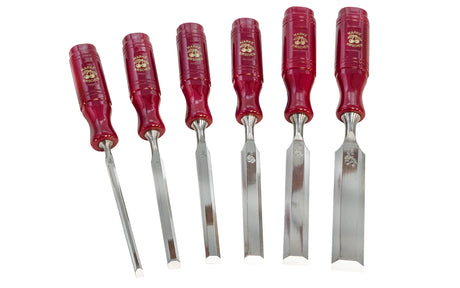 Set of six chisels with red handles on a white background